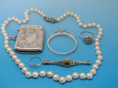 A single strand pearl necklace with hallmarked silver clasp, a hallmarked silver vesta case,