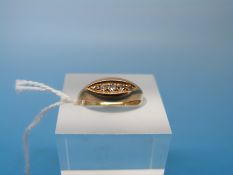An 18ct gold ring set with five diamonds (size J)