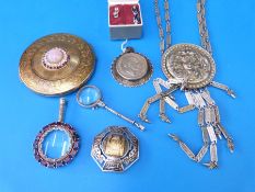 A quantity of white metal and silver items to include brooches, magnifying glasses,