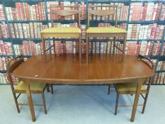 Extendable walnut table by Mackintosh and four matching chairs