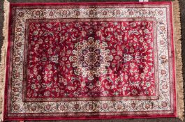 A red ground Kashmir rug with Sharbas design (L168 X W115cm)