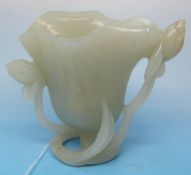 A pale celadon jade vase carved in the form of a lotus flower (height 7.