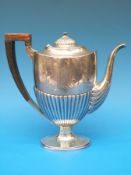 A white metal teapot with fluted lower section stamped sterling to underside (weight 428g in all,