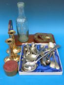 A brass inlaid wooden book slide, a pair of brass candlesticks,