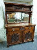 A late 19thC mahogany mirror backed sideboard with shaped bevelled mirror and shelf to top,