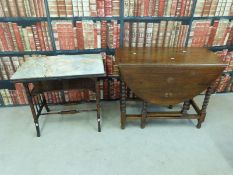 A marble topped Edwardian table and an oak drop leaf table
