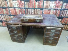 A twin pedestal desk with leather top and nine drawers (H75 x W153 x D91cm)