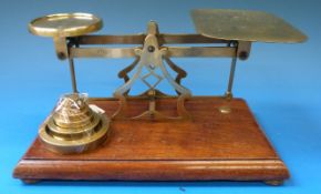 A set of Avery brass framed postage or similar scales with weights to base
