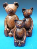 Three graduated moulded Stickland bears,