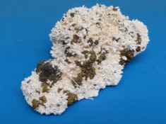 A white geological sample with fools gold and grey,