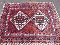 A Turkoman rug with two diagonal guls (204 x 153cm)