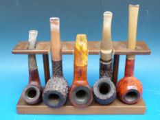 Five pipes including Peterson,