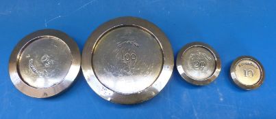 Four brass stacking sovereign weights, comprising 100, 50,