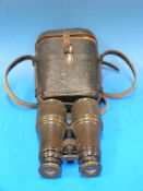 A cased pair of binoculars J.H.