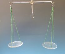 An oak cased set of travelling apothecary beam scales with weights