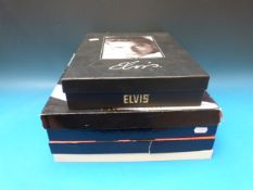 Four Elvis Presley boxed CD sets together with various ephemera