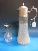 A glass ship's decanter with applied white metal and cabochon decoration