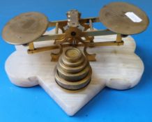 A set of Victorian letter scales on geometric white onyx base with shield-shaped plaque to front