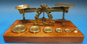 A set of Mordan & Co postage scales, with weights to base, one marked F for Packet Boat services.