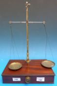 A mahogany cased set of brass travelling apothecary scales by Richrd & George Knight (label to