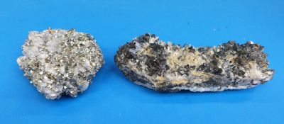 Two geological samples, one formed of dark grey pyrite and some translucent crystals,