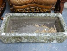 An oblong natural stone trough (length 82cm)