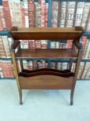 An Edwardian book trough and magazine rack together with a circular occasional table