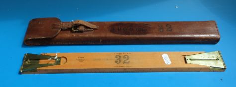 A cased 1915 W H Harling scale rule and sighting rule with ministry mark to instrument and case