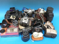 A quantity of vintage and other cameras to include Olympus OM-1N SLR