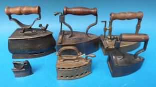 Six variously sized slug irons including novelty examples