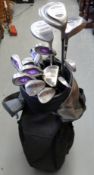 A set of golf clubs to include Cleveland irons, wedges,