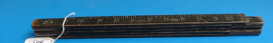 A wooden and brass ministry marked 'Holco' London five part five feet folding ruler,