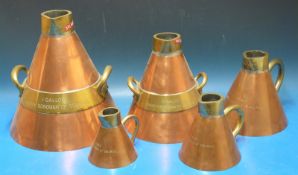 A run of five copper and brass County Borough of Solihull liquid measures (one gallon down to half