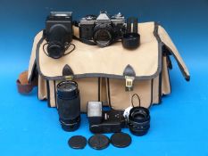 A Fujica AX- 5 SLR camera outfit including 80-200mm Soligor lens, Fujinon 1.2.8 f = 28mm and 1:1.