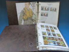 Four albums of GB QE II stamps