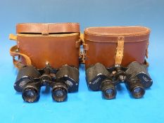 A cased pair of Carl Zeiss Jena Deltrintem 8 x 30 binoculars and a Wray of London Magnivu 8 x 30