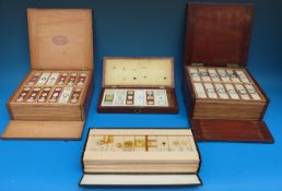 Four cases of microscope slides, mainly geological including marble, granite, hair of mouse,