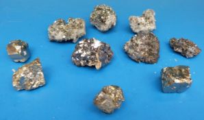 Three bags of geological samples, one with three gold coloured stones,