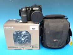 A boxed Fujifilm S2980 digital camera together with a Lowepro carry case