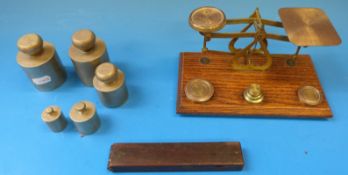 A cased set of guinea scales,