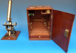 A brass microscope by A Franks of Manchester and Hull in fitted mahogany case