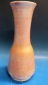 A Moorcroft vase of peach colour