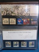 Three albums of presentation packs and two albums of royal family stamps