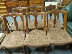 A set of six late 19thC carved oak upholstered chairs