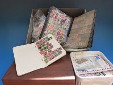 A box of loose stamps, all world stockbooks,