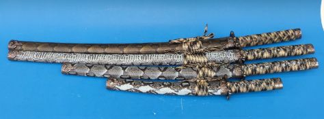Three reproduction Japanese swords and knife