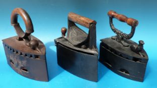 Three irons including a 'Workwell' example,