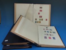 Four matching albums of all world stamps