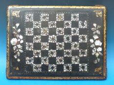 A mother of pearl inlaid papier maché chess board (W45cm x D33cm)