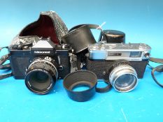 A Nikon Nikkormat FT3 camera with Nikon 50mm lens and a Yashica Minister D camera